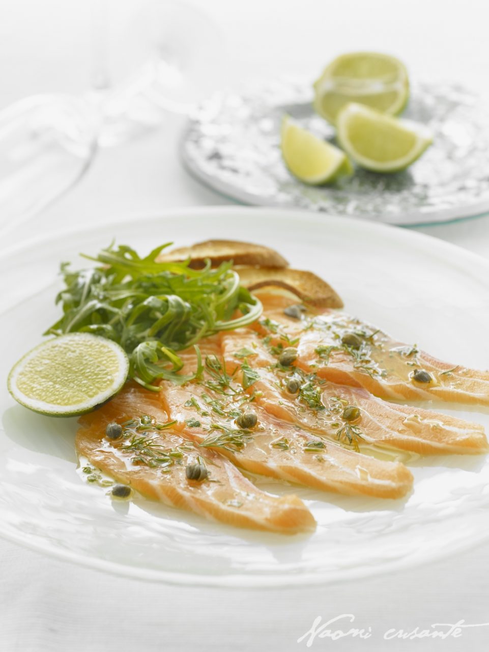 11094787-0086-salmon_carpacci_with_herbed_olive_oil_capers_a